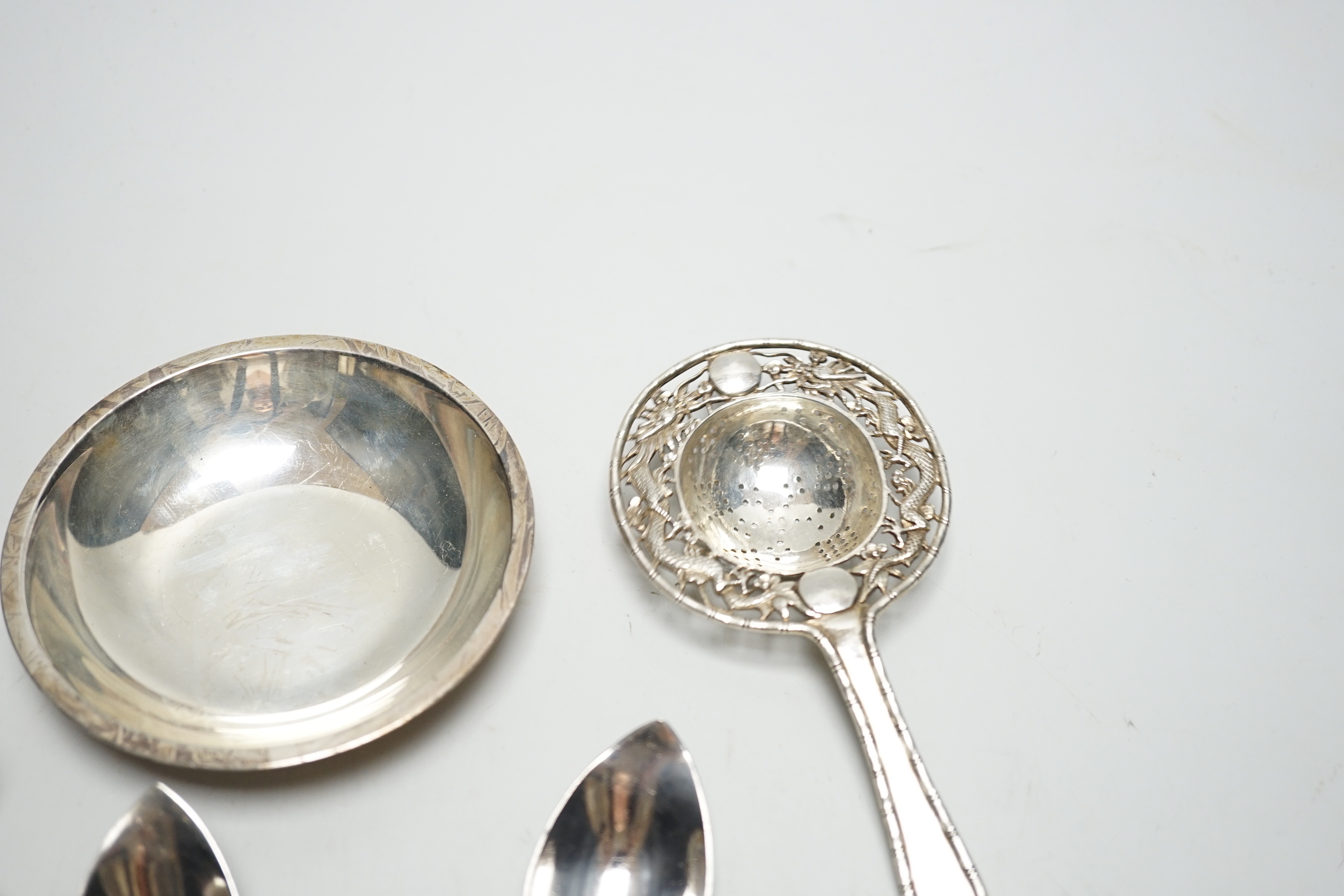 An Elizabeth II silver spoon by Robert Edgar Stone, London, 1957, 10.1cm and sundry silver flatware etc.